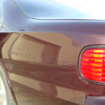 Before and after photographs of a damaged Chevy Impala that was repaired by Elite Paint & Body Shop in West Palm Beach, Florida.